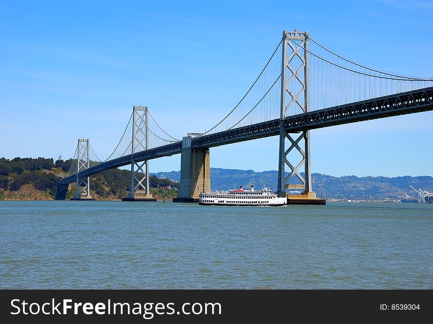 Bay bridge against blue sky background