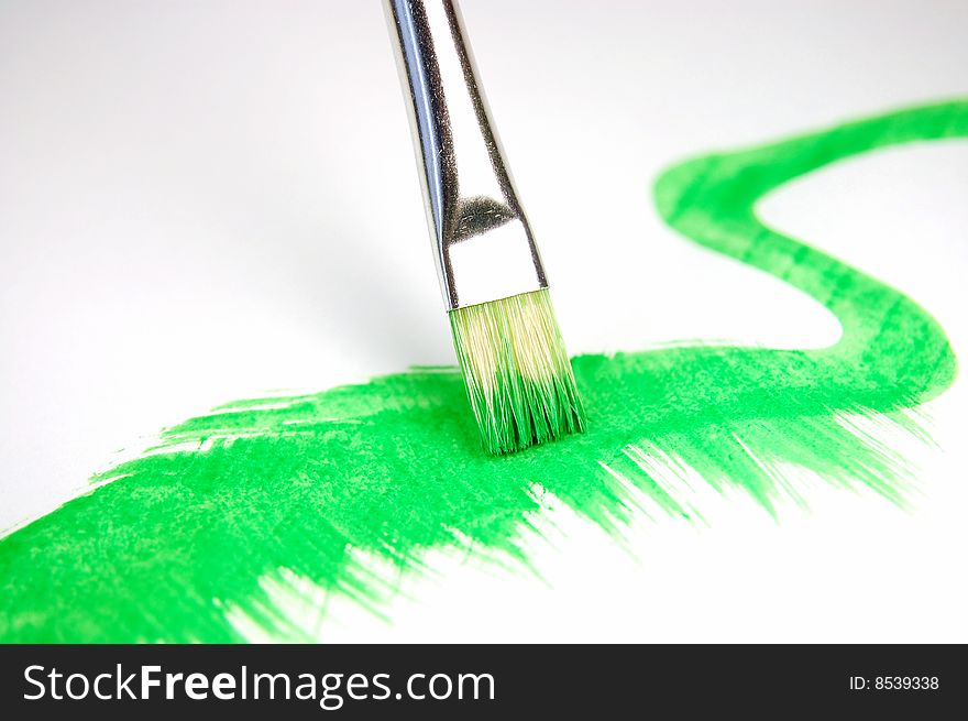 Paintbrush and painted brush stroke isolated