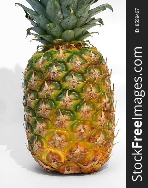 A ripe pineapple isolated on white