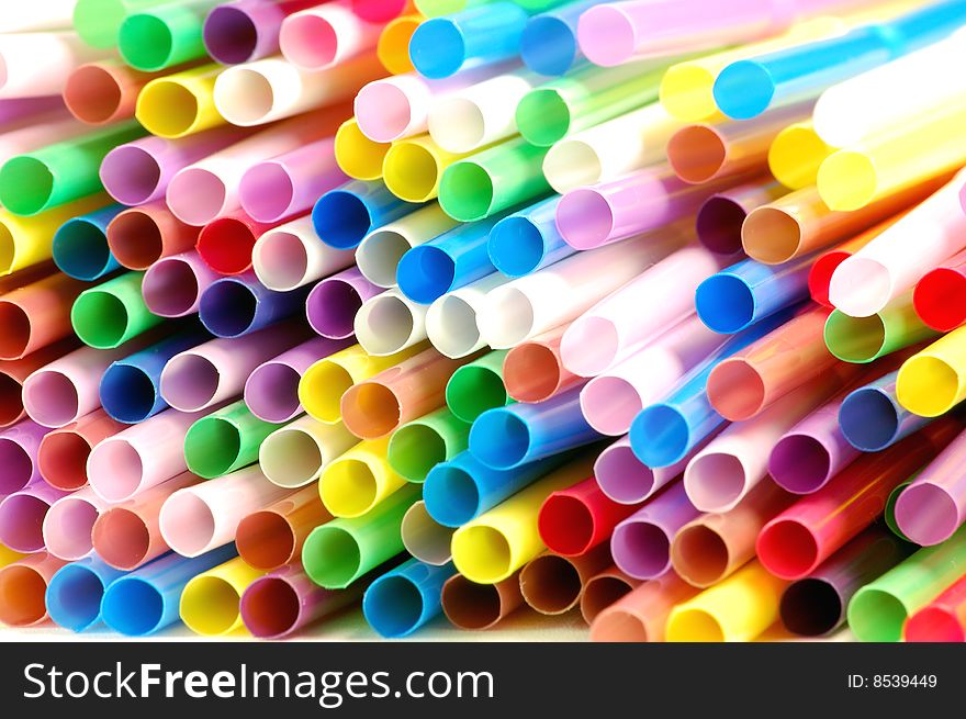 Many color cocktail straws isolated on white