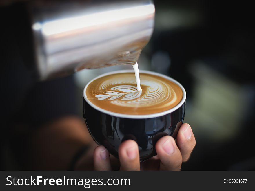 Close-up of Woman Holding Coffee Cup at Cafe