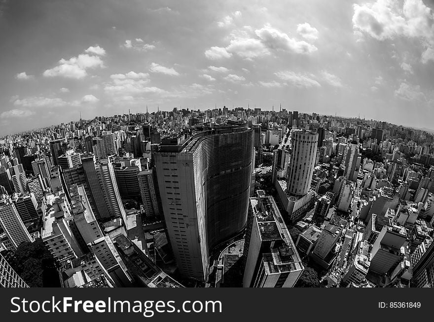 High Angle View of Cityscape Against Cloudy Sky