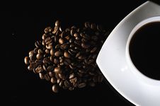 A White Cup Of Coffee And Coffee Beans Royalty Free Stock Photo A White Cup Of Coffee And Coffee Beans Royalty Free Stock Photo