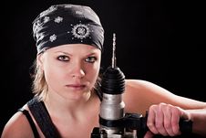 Severe Young Woman With A Drill Stock Photo Severe Young Woman With A Drill Stock Photo