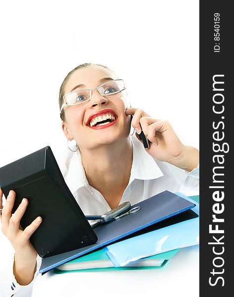Happy young excited businesswoman talking on the phone
