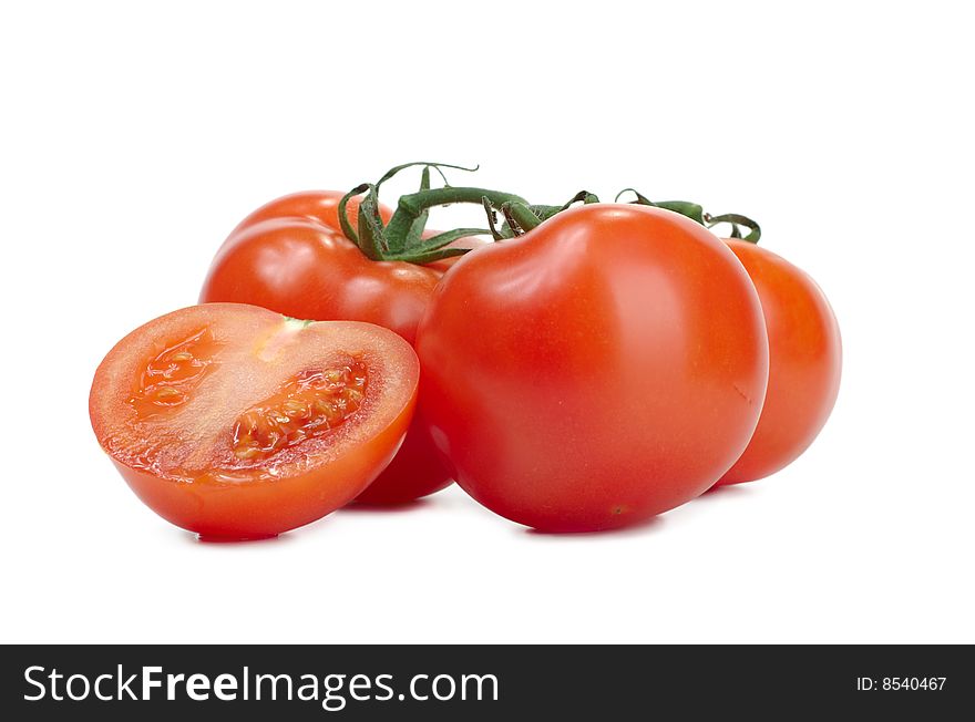Some fresh red tomatoes on a white background