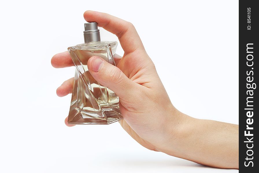 Man's hand with bottle of perfume isolated on white background. Man's hand with bottle of perfume isolated on white background