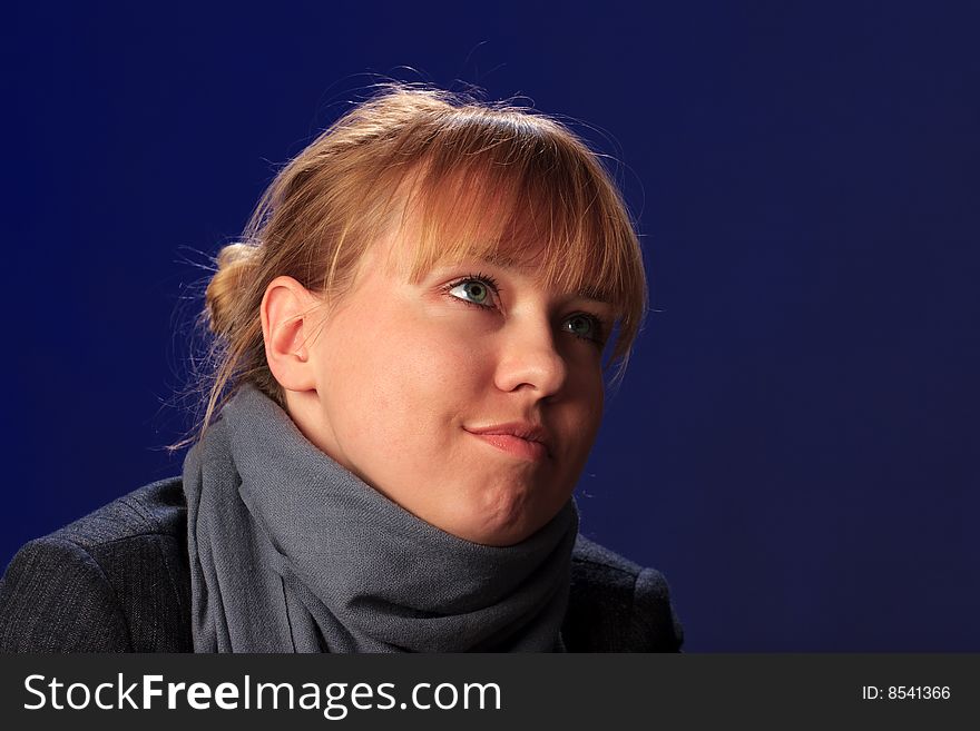 Portrait of female on a blue background in studio