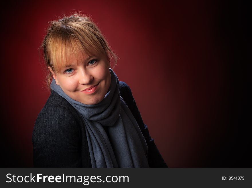 Portrait of female on a red background in studio