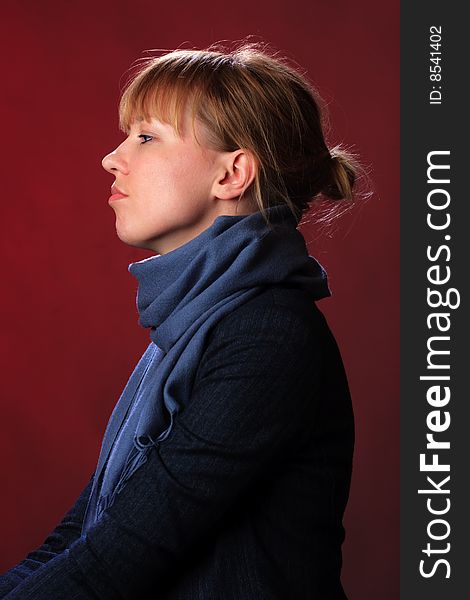 Portrait of female on a red background in studio