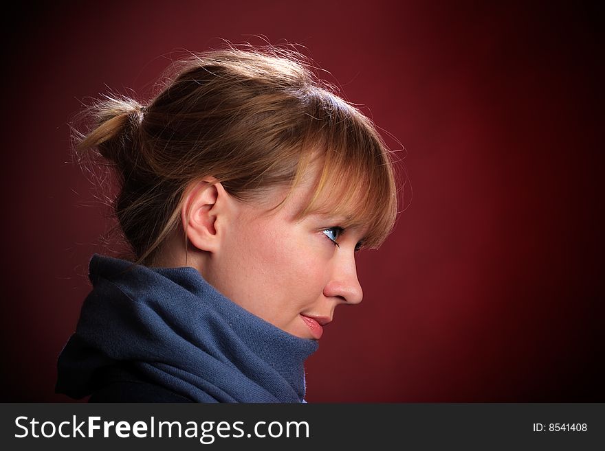 Portrait of female on a red background in studio