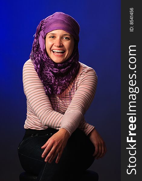 Portrait of female on a blue background in studio