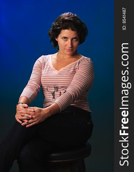 Portrait of female on a blue background in studio