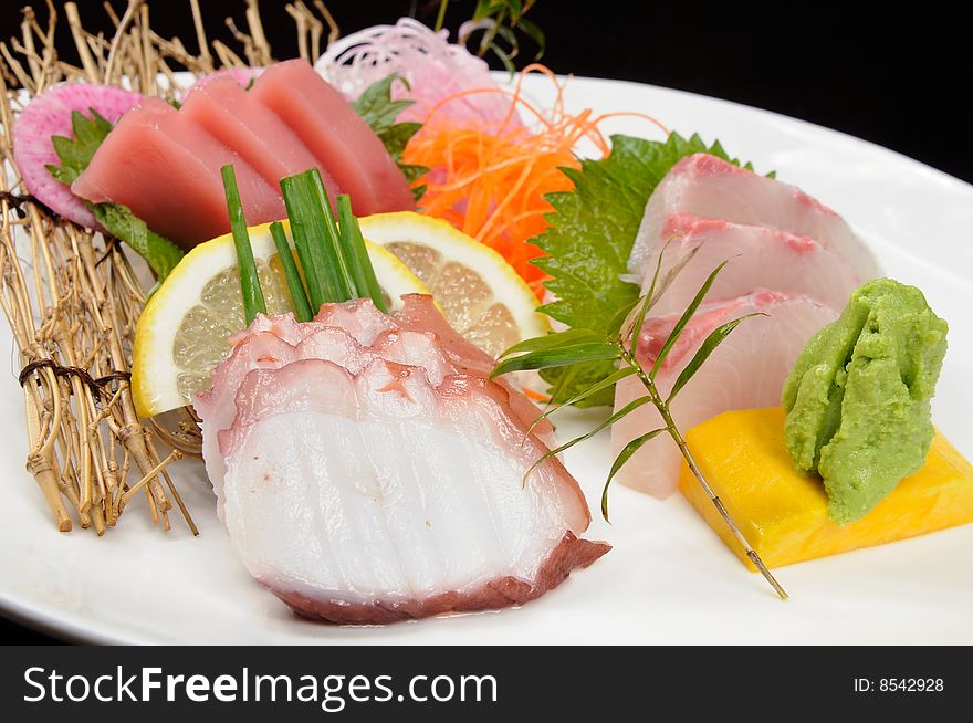 Japanese sashimi on a white dish