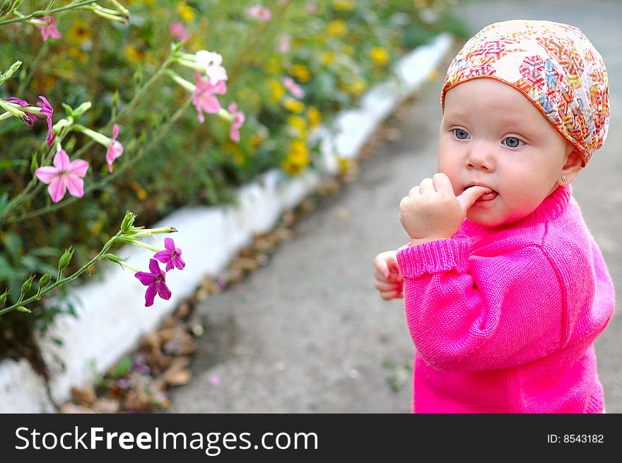 Pretty little girl with flowers.