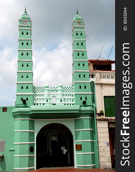 South Bridge Road facade of the 1826 Jamae Chulia Mosque in the Chinatown district of Singapore with its slender twin minarets - Lee Snider Photo. South Bridge Road facade of the 1826 Jamae Chulia Mosque in the Chinatown district of Singapore with its slender twin minarets - Lee Snider Photo.