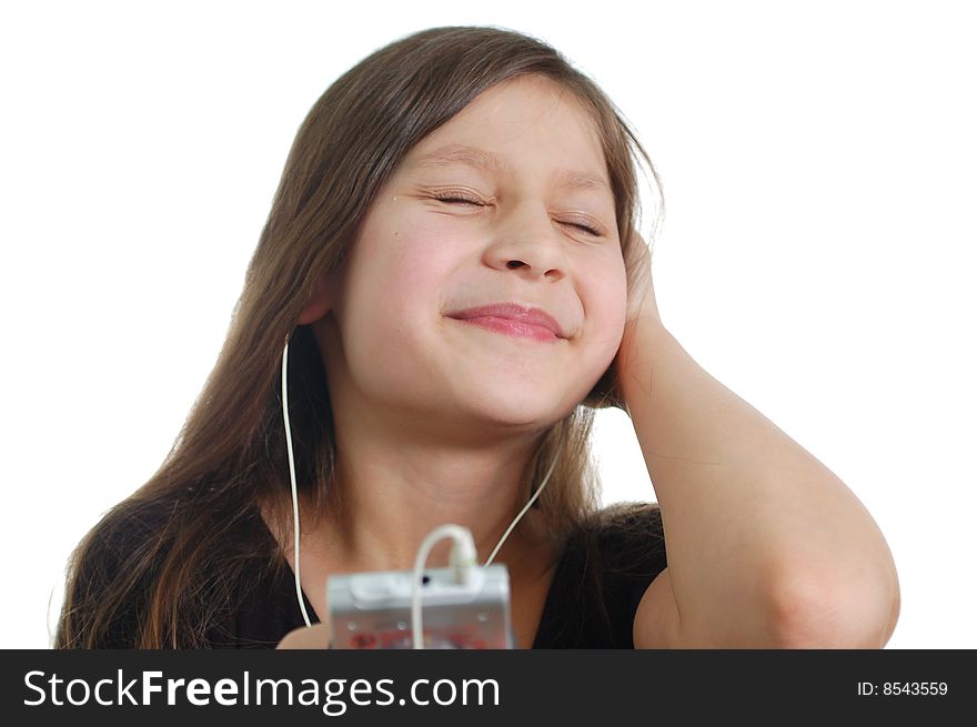 The little cute girl listen the music(holding the pleer )