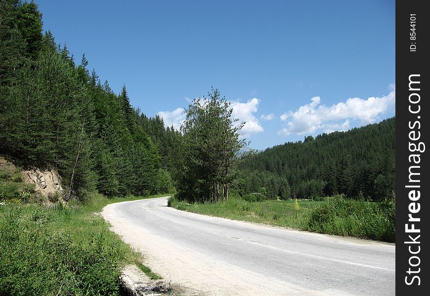 A road where few cars pass, near Pirin Mountain, Bulgaria. A road where few cars pass, near Pirin Mountain, Bulgaria