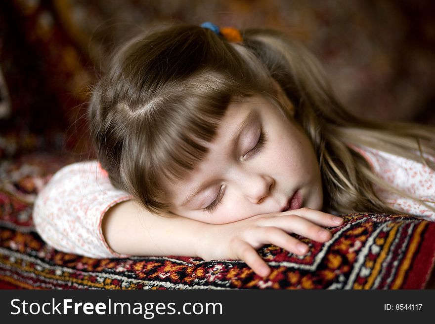 Stock photo: an image of a nice sleeping girl on a sofa. Stock photo: an image of a nice sleeping girl on a sofa