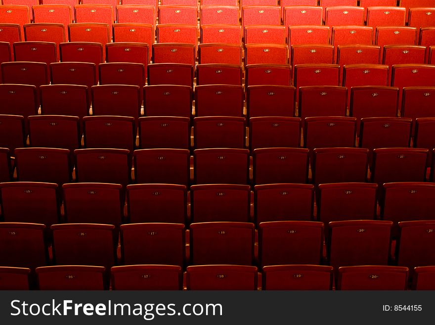 Stock photo: an image of many red empty seats