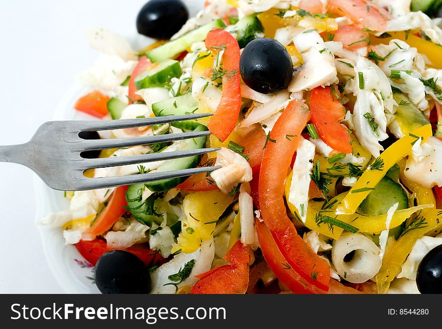 Stock photo: an image of fork and fresh salad. Stock photo: an image of fork and fresh salad