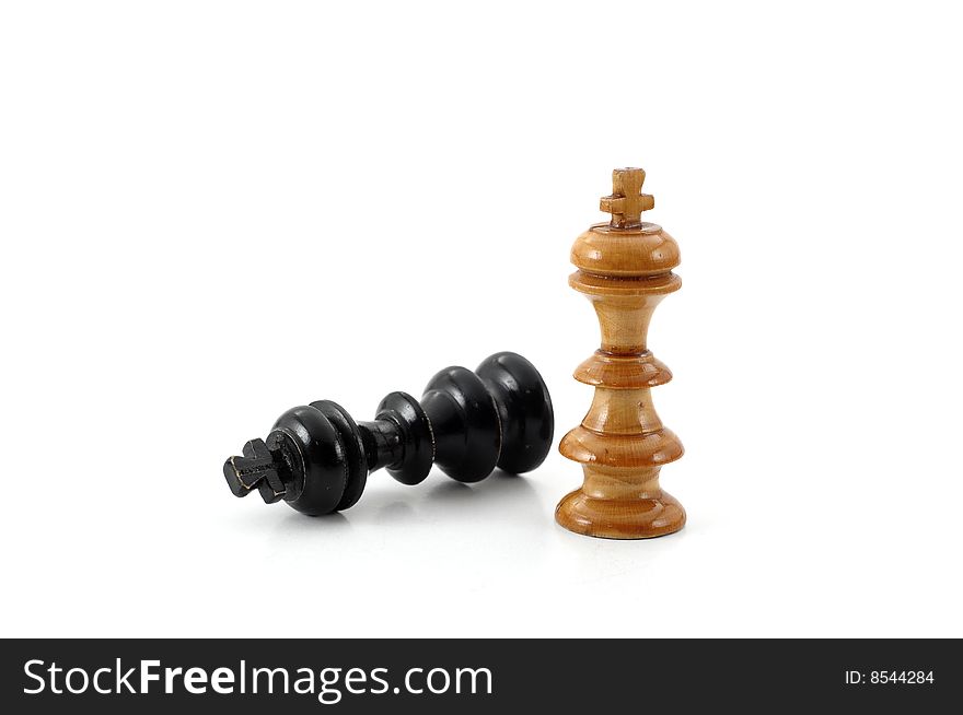 White king takes a victory over the black one, isolated on white background. White king takes a victory over the black one, isolated on white background