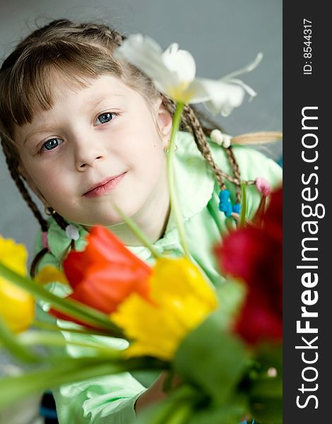 Stock photo: an image of a girl with tulips