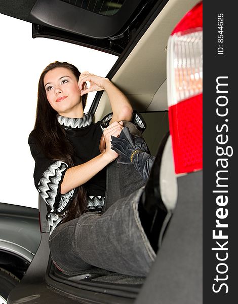 Pretty women sit in car boot. Pretty women sit in car boot