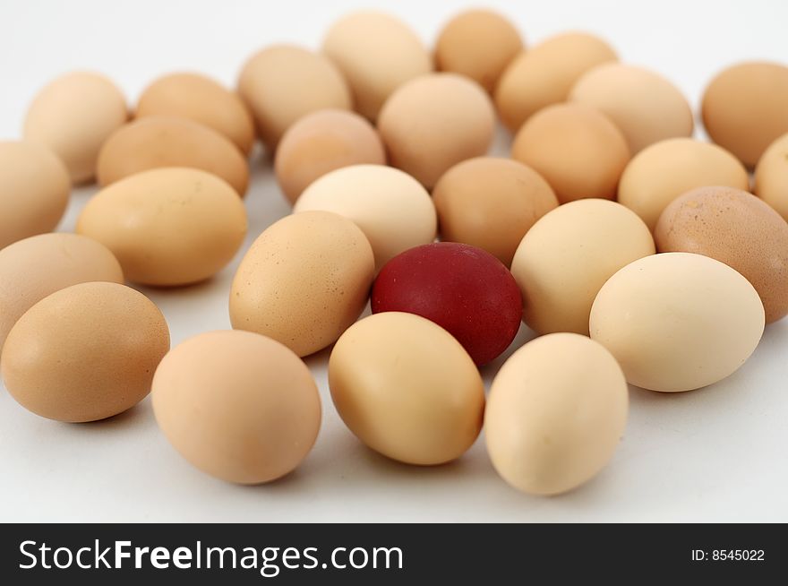 Easter eggs on white background, focus on red egg