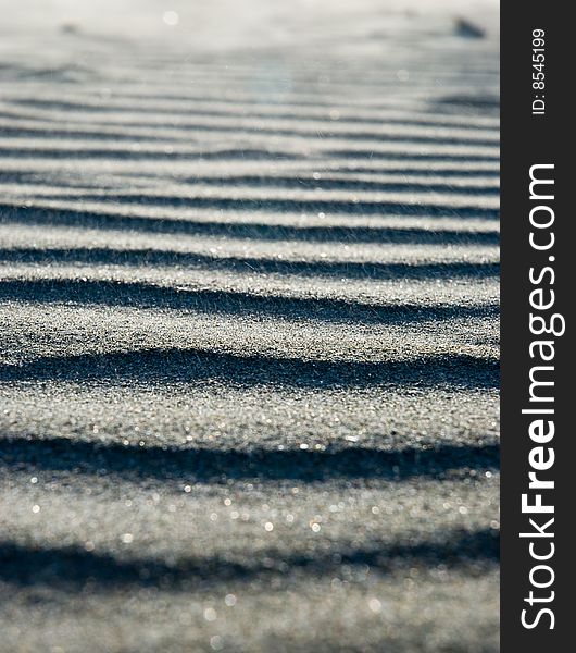 Close up on ripples in the sand.