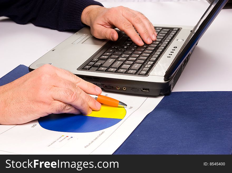 Hands working on computers and business relations