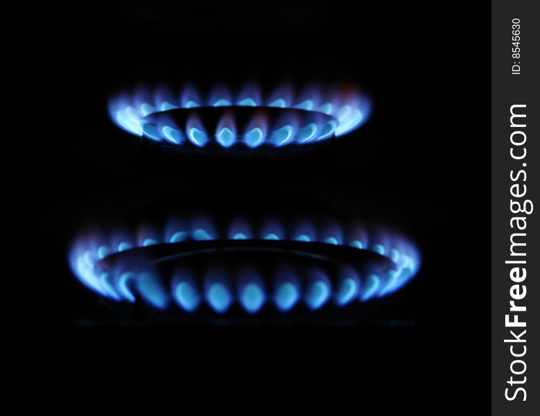 Flames of gas stove in the dark