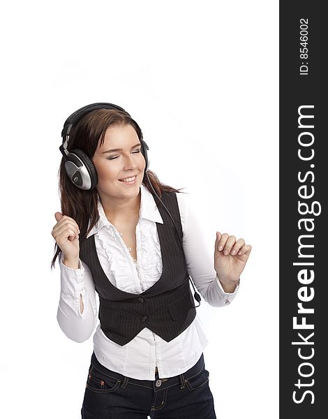 Isolated young business woman listening music over white background