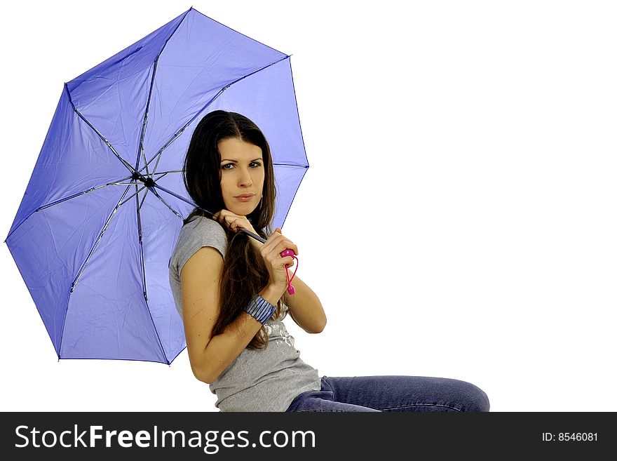 Attractive woman in casual wear with blue umbrella, sitting on a chair as if she's waiting for someone. Attractive woman in casual wear with blue umbrella, sitting on a chair as if she's waiting for someone