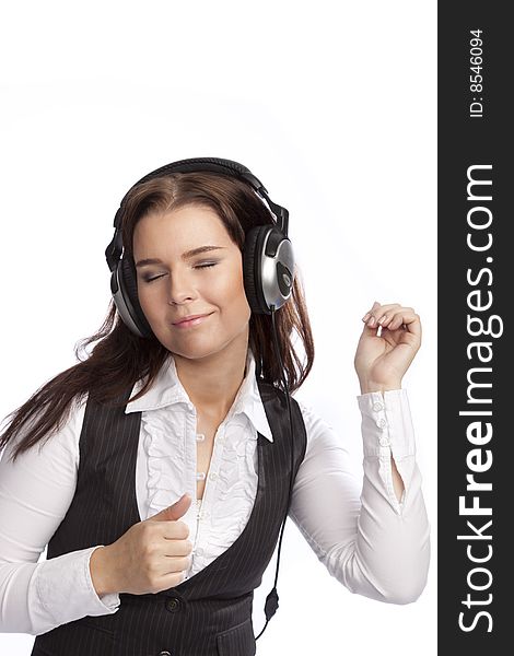 Isolated young business woman listening music over white background