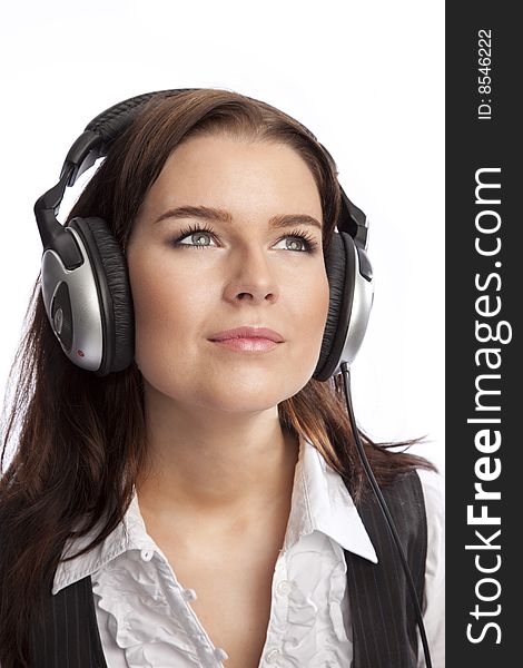 Isolated young business woman listening music over white background