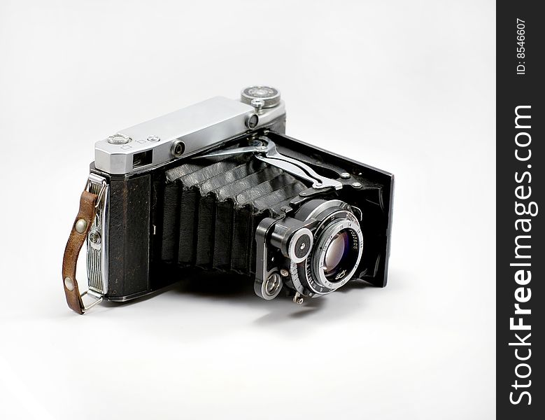 Old film photo camera and isolated on a white background