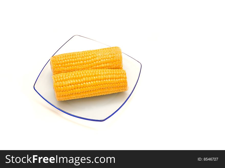 Corn on a plate. The isolated background