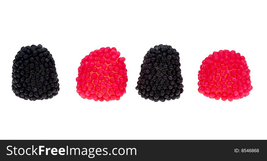 Black and red berry shaped candies isolated on a white background