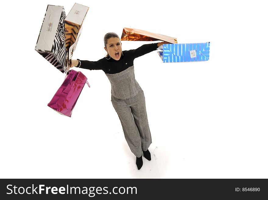 Young woman in business wear making shopping and throwing around lots of colorful shopping bags, looking euphoric, isolated on white. Young woman in business wear making shopping and throwing around lots of colorful shopping bags, looking euphoric, isolated on white