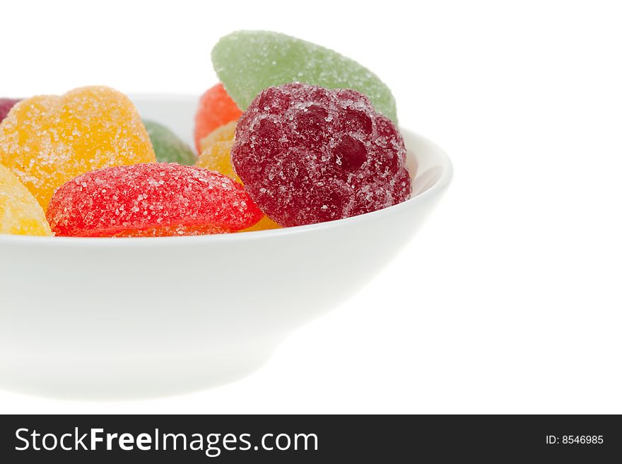 Bowl of fruit candy isolated