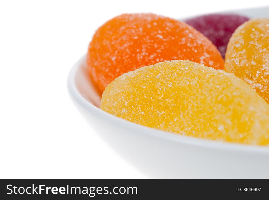 Bowl of fruit candy isolated