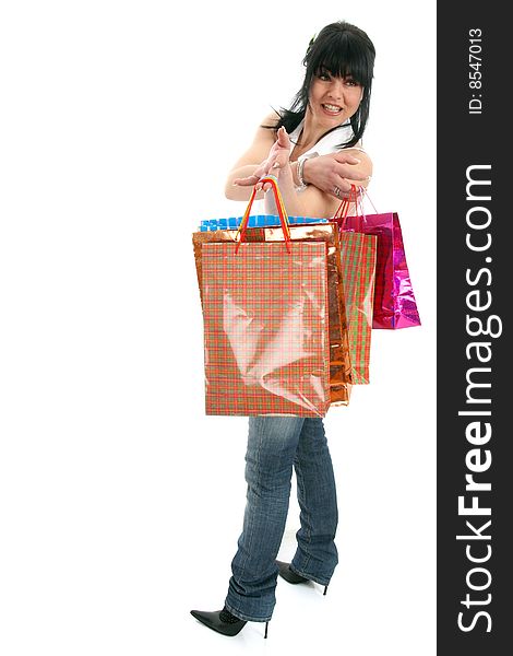 Attractive young woman making shopping with lots of colorful shopping bags, smile and casual wear. Showing what she've bought. Isolated on white. Attractive young woman making shopping with lots of colorful shopping bags, smile and casual wear. Showing what she've bought. Isolated on white.