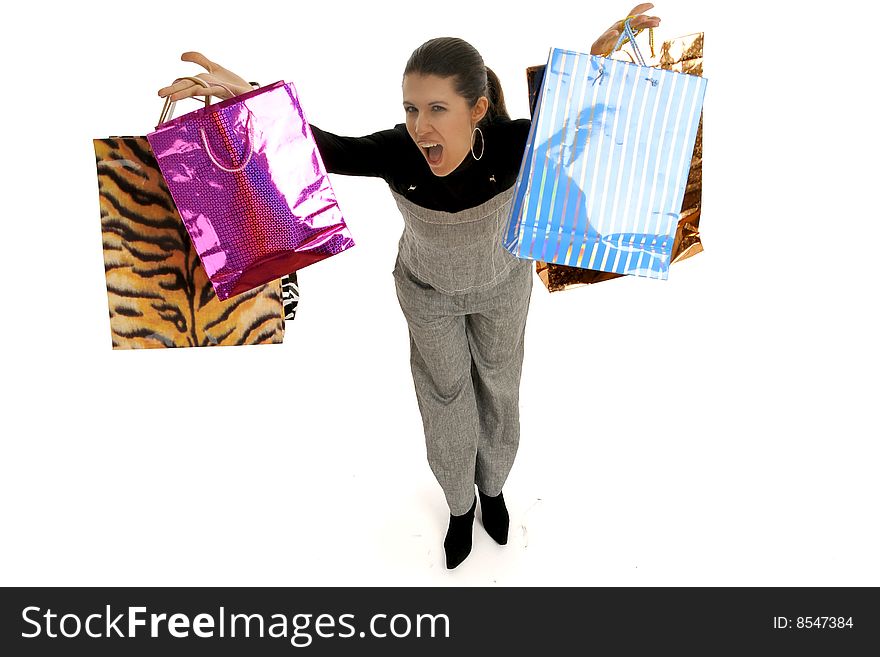 Young woman in business wear making shopping and shaking around lots of colorful shopping bags, looking euphoric, isolated on white. Full body elevated view. Young woman in business wear making shopping and shaking around lots of colorful shopping bags, looking euphoric, isolated on white. Full body elevated view.