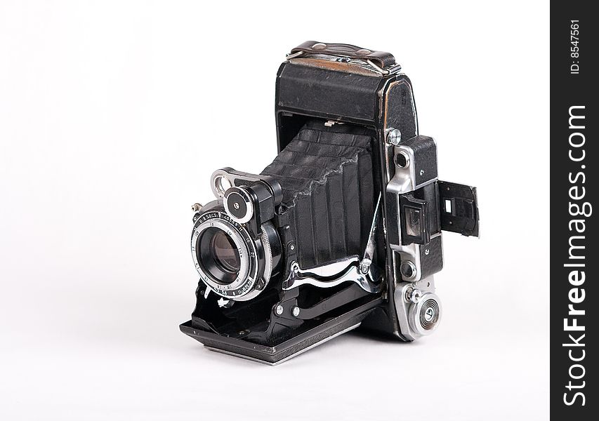 Photo of vintage photocamera on the white background. Photo of vintage photocamera on the white background