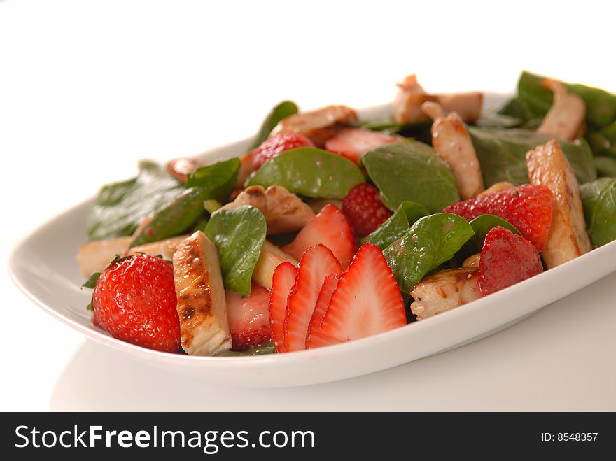 Fresh spinach and strawberry salad with grilled chicken