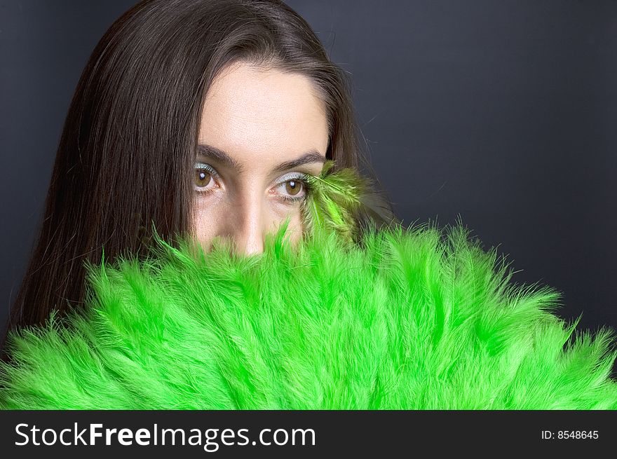 Portrait attractive young woman with green fan. Portrait attractive young woman with green fan