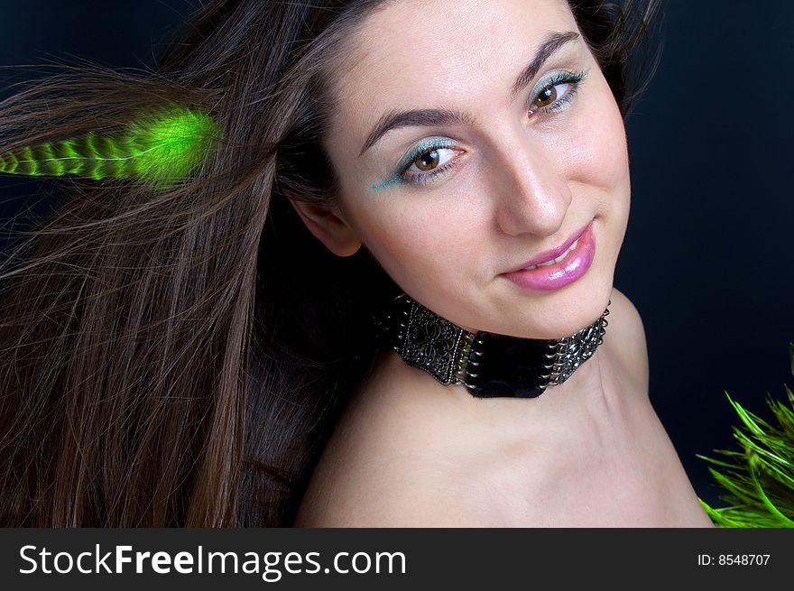 Portrait beautiful woman with blowing hair and feathers. Portrait beautiful woman with blowing hair and feathers