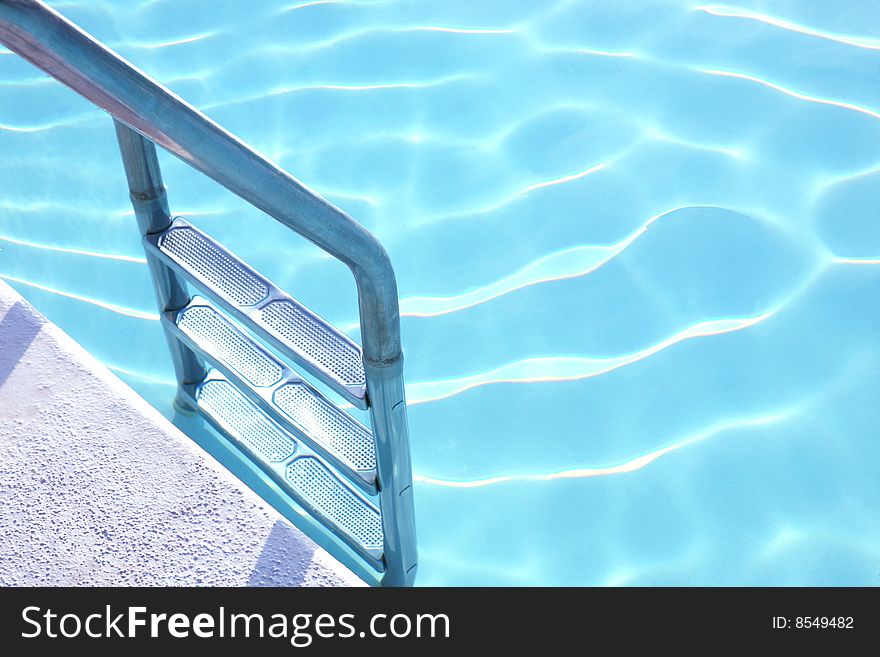 Fragment Of Pool With A Ladder And  Water