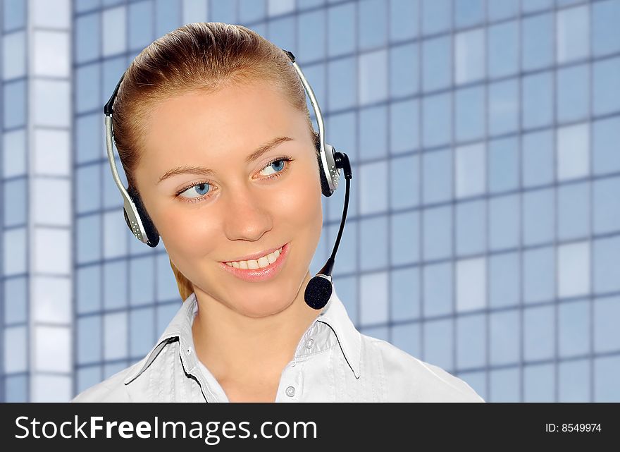 Woman wearing headset in office; could be receptionist